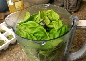 Freezing basil to add to recipes year round is so easy! It's my favorite way to preserve summer.