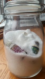 Make your own soothing bath salts using your empty essential oil bottles. Frugal and healing!
